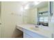 Clean bathroom with a vanity, mirror, and storage at 2535 Lancaster Dr # 2535, Sun City Center, FL 33573