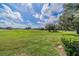 Spacious backyard with lush green grass at 2535 Lancaster Dr # 2535, Sun City Center, FL 33573