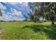 Open green space behind the property at 2535 Lancaster Dr # 2535, Sun City Center, FL 33573