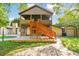 Two-story house with a deck, screened porch, and detached garage at 10213 Newport Cir, Tampa, FL 33612