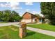 Two-story house with a large yard, attached garage, and stone accents at 10213 Newport Cir, Tampa, FL 33612
