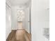 Hallway with light wood-look flooring and access to rooms at 3457 22Nd S Ave, St Petersburg, FL 33711