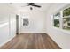 Spacious bedroom with wood-look floors, ceiling fan and window at 3457 22Nd S Ave, St Petersburg, FL 33711