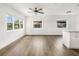 Open living area with wood-look floors and kitchen island at 3457 22Nd S Ave, St Petersburg, FL 33711