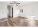 Light and airy bedroom with wood-look floors and ceiling fan at 3457 22Nd S Ave, St Petersburg, FL 33711