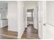 Clean hallway with wood-look floors and access to bathroom at 3457 22Nd S Ave, St Petersburg, FL 33711