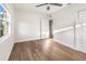 Bright bedroom with wood-look floors, ceiling fan, and window at 3457 22Nd S Ave, St Petersburg, FL 33711