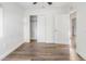 Well-lit bedroom featuring wood-look floors and closet at 3457 22Nd S Ave, St Petersburg, FL 33711