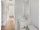 Simple bathroom with white vanity and a mirror at 3457 22Nd S Ave, St Petersburg, FL 33711