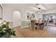 Dining area with a wood table, stylish light fixture, and view of an adjacent room at 10248 Oakhaven Dr, Pinellas Park, FL 33782