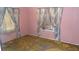 Pink bedroom with window and wall-mounted AC unit at 1320 Springdale St, Clearwater, FL 33755