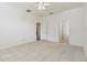 Bedroom with tile floor showing access to a bathroom and closet at 3232 Gianna Way, Land O Lakes, FL 34638