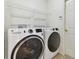 Laundry room featuring modern washer and dryer, and wire shelving at 3232 Gianna Way, Land O Lakes, FL 34638