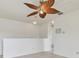 Open loft area featuring a decorative ceiling fan at 3232 Gianna Way, Land O Lakes, FL 34638