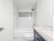 Bathroom featuring a tub and shower combination with tile surround and vanity with modern finishes at 6907 N 20Th St, Tampa, FL 33610