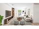 Cozy living room with stylish decor, wood floors, and ample seating at 6907 N 20Th St, Tampa, FL 33610