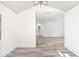 View from living room to bathroom shows nice floorplan with hardwood floors at 6907 N 20Th St, Tampa, FL 33610