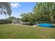 Spacious backyard with water access and a kayak at 4915 W Melrose N Ave, Tampa, FL 33629