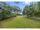 Spacious backyard with lush landscaping and room for outdoor activities at 4915 W Melrose N Ave, Tampa, FL 33629