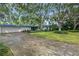Mid-century modern home with carport and lawn at 4915 W Melrose N Ave, Tampa, FL 33629