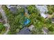 Aerial view of a waterfront property with a metal roof at 4915 W Melrose N Ave, Tampa, FL 33629