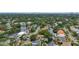 Aerial showing a neighborhood with houses and waterways at 4915 W Melrose N Ave, Tampa, FL 33629