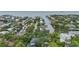 Aerial view of waterfront homes and lush landscape at 4915 W Melrose N Ave, Tampa, FL 33629