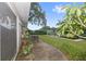 Private patio with seating area and lush landscaping at 4915 W Melrose N Ave, Tampa, FL 33629