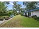 Landscaped backyard with patio and water access at 4915 W Melrose N Ave, Tampa, FL 33629