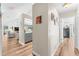 Bright hallway with views into the living room and kitchen at 1804 New Bedford Dr, Sun City Center, FL 33573