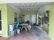 Covered patio with concrete flooring and storage area at 1528 Stevensons Dr, Clearwater, FL 33755