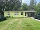 House exterior featuring a green painted house and carport at 1528 Stevensons Dr, Clearwater, FL 33755