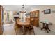 Rustic dining area with a large wooden table and fireplace at 244 Lark Ave, Brooksville, FL 34601