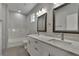 Bathroom with double vanity and marble tile at 2604 N 29Th St, Tampa, FL 33605