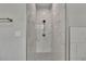 Clean shower with marble-style tile and handheld shower head at 2604 N 29Th St, Tampa, FL 33605