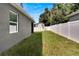 Fenced backyard with grassy area, providing a private outdoor space at 2604 N 29Th St, Tampa, FL 33605