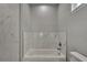 Bathroom with soaking tub and marble tile at 2604 N 29Th St, Tampa, FL 33605