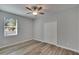 Bright bedroom with wood-look floors and double closet at 2604 N 29Th St, Tampa, FL 33605