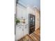 Custom kitchen featuring stainless steel refrigerator, granite counters, and modern cabinets at 180 Keystone Palms Blvd, Tarpon Springs, FL 34688