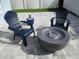 Relaxing patio with fire pit and comfortable chairs at 912 Landmark S Cir, Tierra Verde, FL 33715