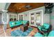 Covered patio with comfortable seating and pool view at 180 Keystone Palms Blvd, Tarpon Springs, FL 34688