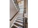 Elegant staircase with dark wood and wrought-iron railings at 180 Keystone Palms Blvd, Tarpon Springs, FL 34688