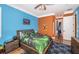 Bright bedroom with blue and orange color scheme at 180 Keystone Palms Blvd, Tarpon Springs, FL 34688