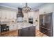 Bright kitchen features granite countertops, large island, and custom cabinetry at 180 Keystone Palms Blvd, Tarpon Springs, FL 34688