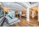 Open living and dining area with hardwood floors, neutral decor, and a view of the pool at 180 Keystone Palms Blvd, Tarpon Springs, FL 34688