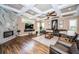 Spacious living room with hardwood floors, a fireplace, and coffered ceilings at 180 Keystone Palms Blvd, Tarpon Springs, FL 34688