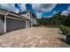 Spacious three-car garage with paver driveway at 180 Keystone Palms Blvd, Tarpon Springs, FL 34688
