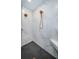 Walk-in shower with marble tile and herringbone patterned floor at 180 Keystone Palms Blvd, Tarpon Springs, FL 34688