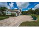 Large home with 3-car garage and paver driveway at 180 Keystone Palms Blvd, Tarpon Springs, FL 34688