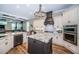 Open kitchen with large island, stainless steel appliances, and ample cabinet space at 180 Keystone Palms Blvd, Tarpon Springs, FL 34688